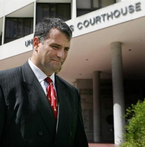 Abramoff, looking busted with courthouse in background